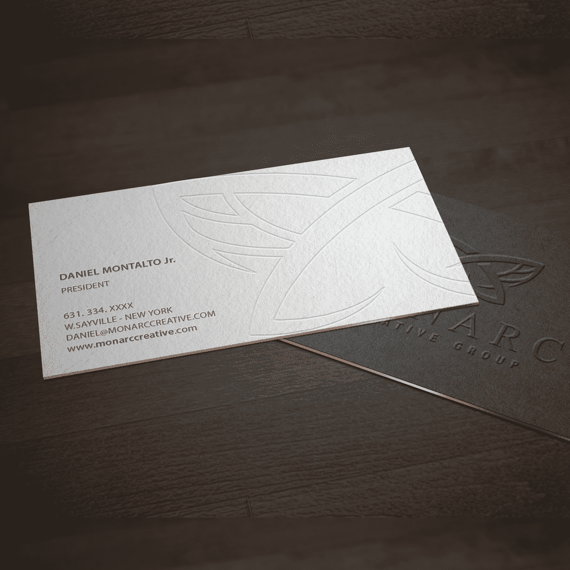 Fine line imprinted on business card for a subtle logo on the background