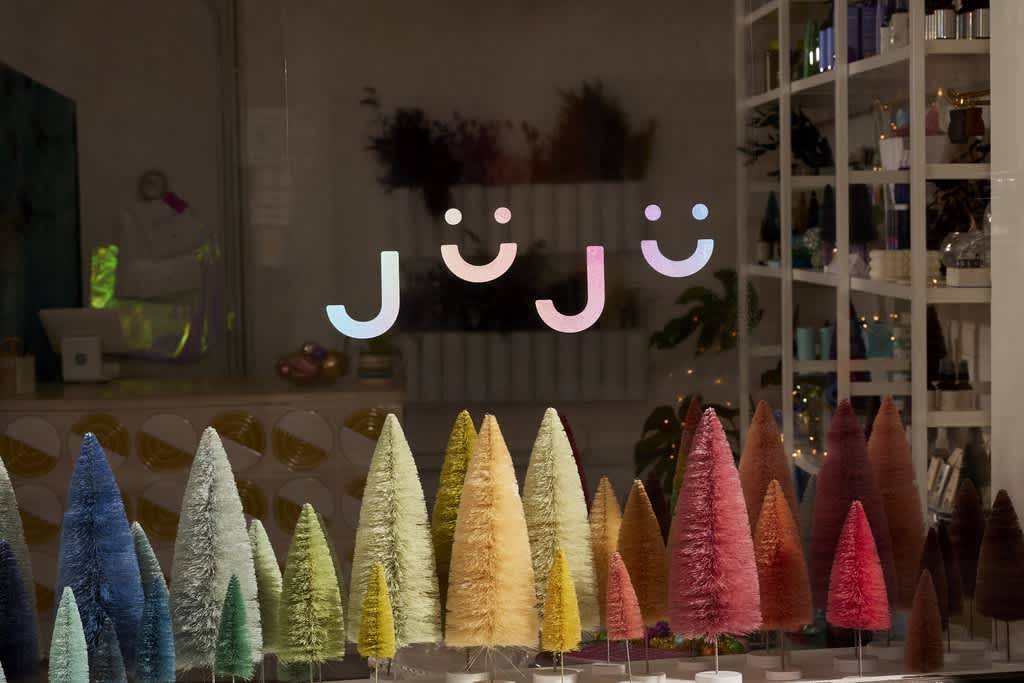 Festive window decal for a retail store, holiday signage ideas.